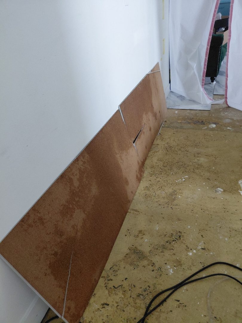Containment — zippered poly door sealing the work zone